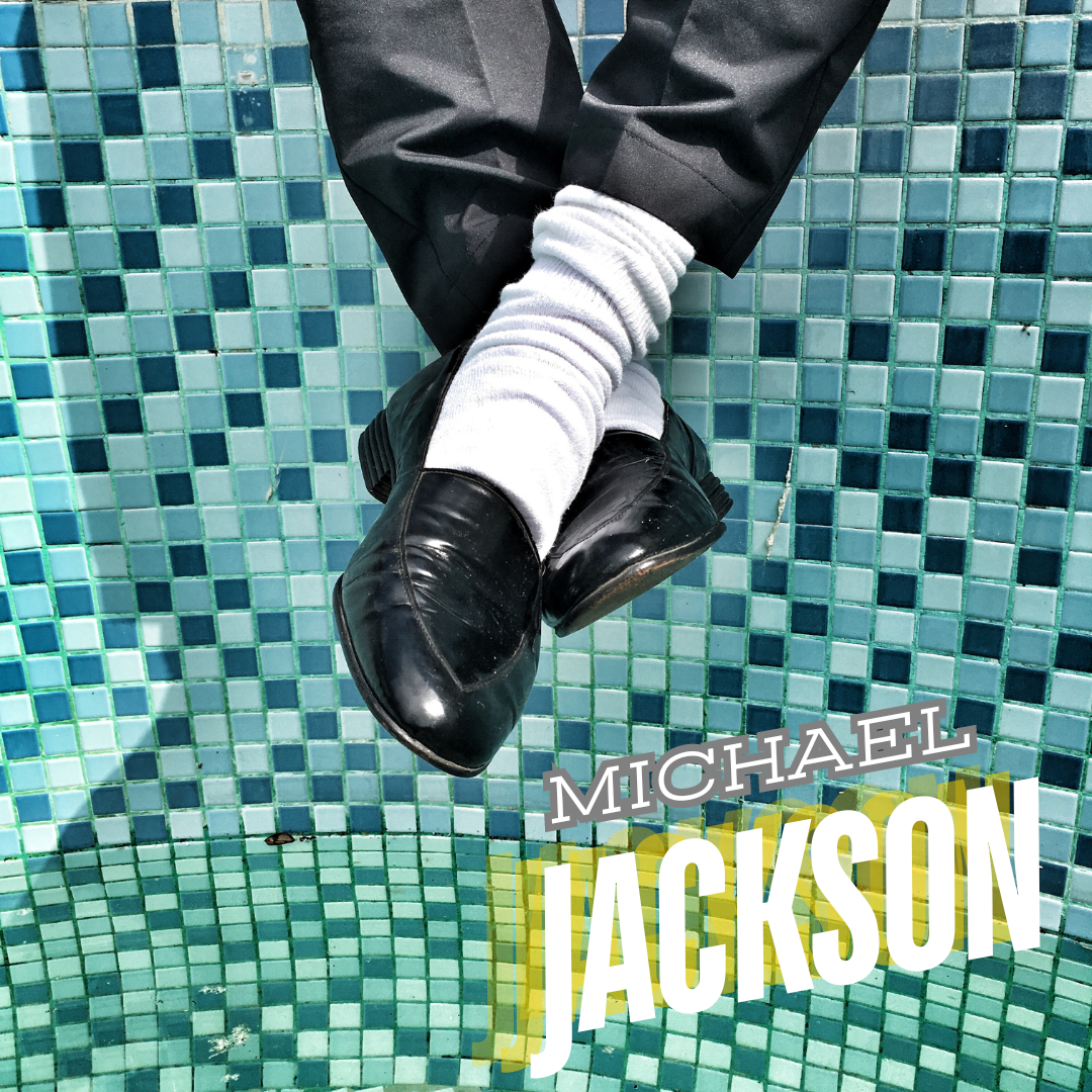Portion of the legs shown with the feet dangling. The fee have slick shoes on them. The background is checkered with the colors blue, black, and green. It also has a Michael Jackson wording at the bottom right of the image.